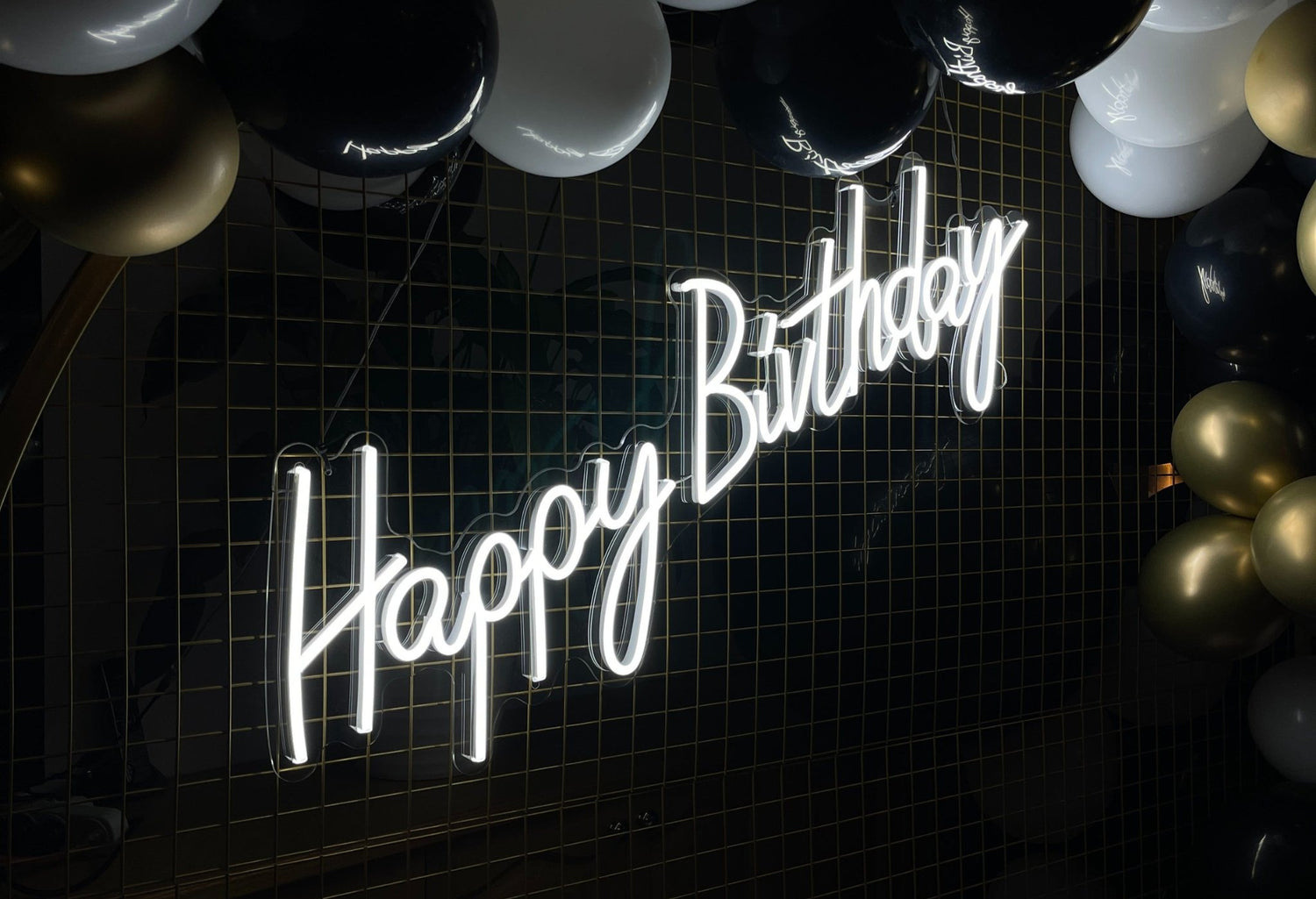 Colorful birthday neon sign with bright lights and festive decorations