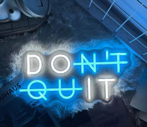 Gym neon sign with the phrase 'Don't quit' in sky blue and white.