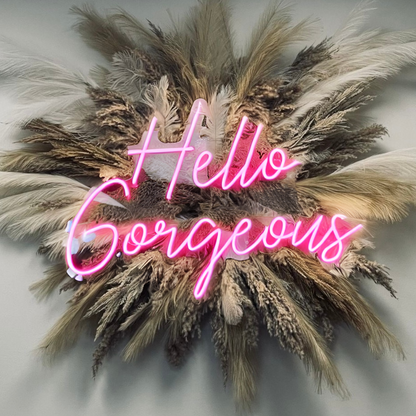 Pink 'Hello Gorgeous' neon sign with elegant script and soft, inviting glow, ideal for salon decor and creating a welcoming atmosphere