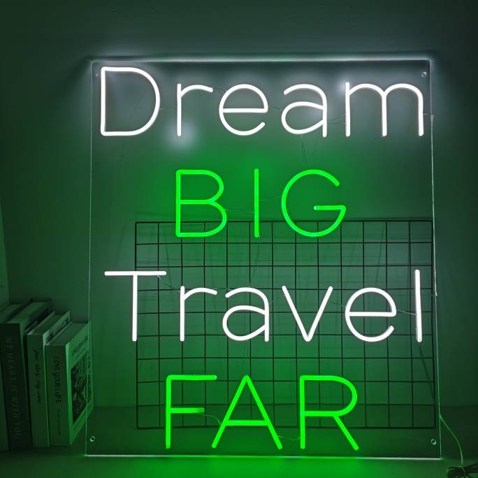 Dream Big Travel Far quote neon sign