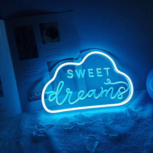 A children's room neon sign that has sweet dreams engraved into it