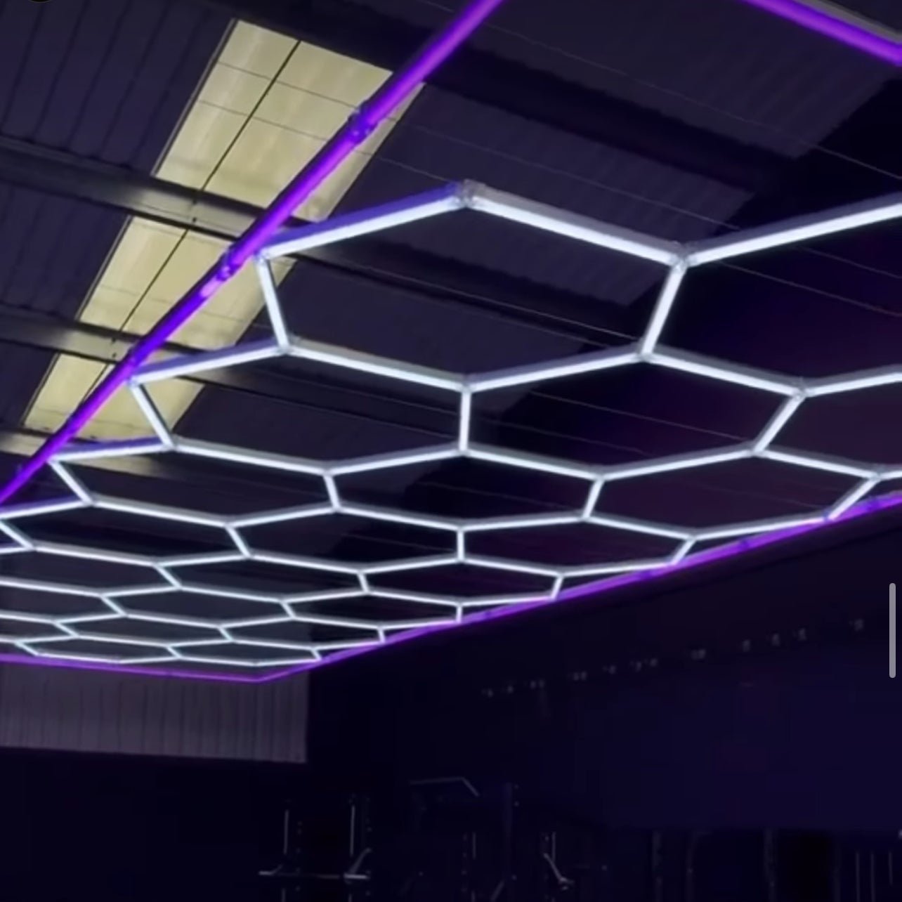 Hexagon Lights 14 Grid with Purple Frame in a garage - Neon Signs UK