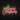 Red and green merry christmas neon sign with holly bush