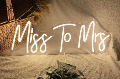 Elegant 'Miss to Mrs' wedding neon sign with bright LEDs, perfect for bridal events and wedding decor.