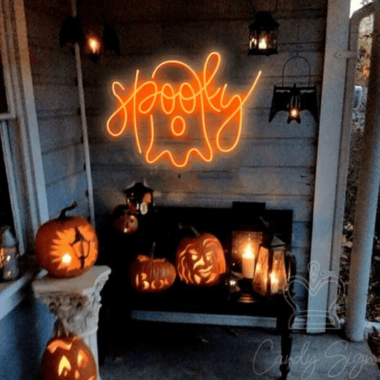 A spooky Halloween neon sign of a ghost in orange with the word ''spooky'' interweaved into it