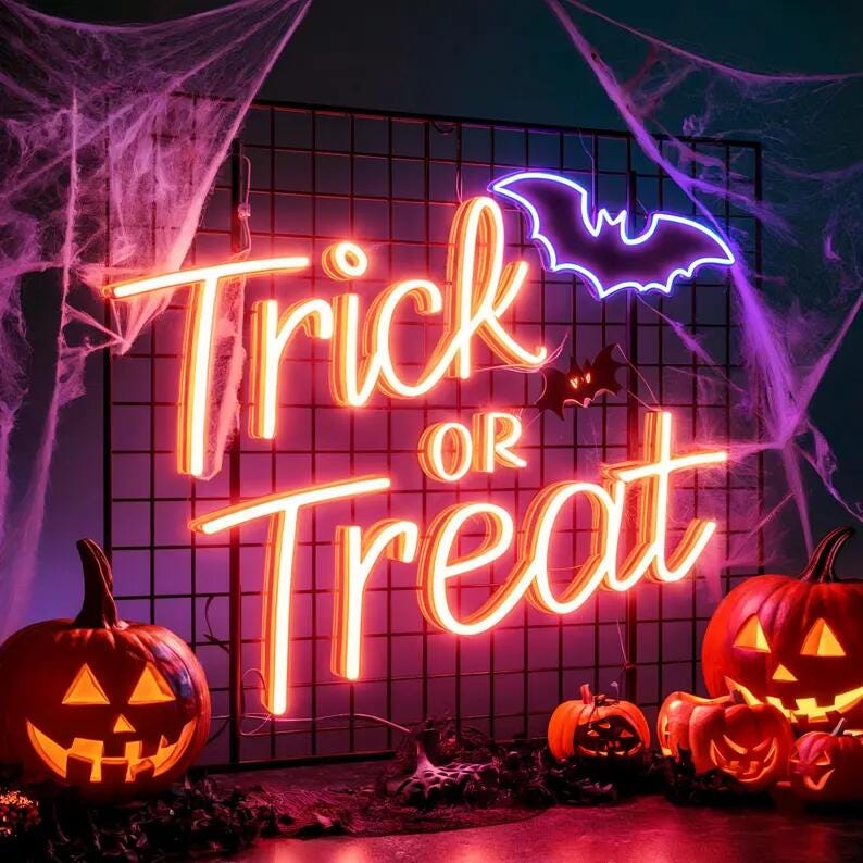 trick or treat halloween neon sign in orange neon